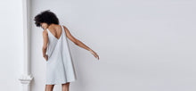 A-line, technical wrap dress with a V-neck and adjustable, removable belt. Technical apparel by ADAY, perfect for travel.