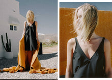 A-line, technical wrap dress with a V-neck and adjustable, removable belt. Technical apparel by ADAY, perfect for travel.