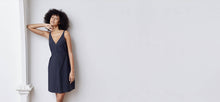 A-line, technical wrap dress with a V-neck and adjustable, removable belt. Technical apparel by ADAY, perfect for travel.