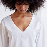 V neck style technical long sleeve top with cuffed sleeves and back pleat. Technical apparel by ADAY, perfect for travel.