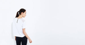 ADAY white neoprene top with mesh panel. Technical apparel.