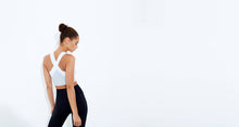 High impact minimal sports bra with bonded straps and a long front body