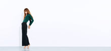 Technical forest green body suit with bonded seams, a high neck line + extra long sleeves