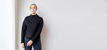 Black technical modal sweatshirt with laser cut bonded collar and vented back panel by ADAY