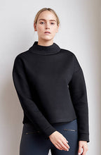 Black technical modal sweatshirt with laser cut bonded collar and vented back panel by ADAY