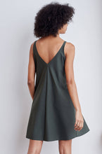 A-line, technical wrap dress with a V-neck and adjustable, removable belt. Technical apparel by ADAY, perfect for travel.