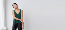 A-line tank top with a v-neck and v-back, bonded hem and lower arm holes. Super soft to touch, made from a plant based fiber.