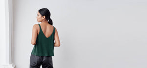 A-line tank top with a v-neck and v-back, bonded hem and lower arm holes. Super soft to touch, made from a plant based fiber.