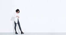 Grey colored technical leggings with bonded seams, gunmetal zippers + a side phone pocket