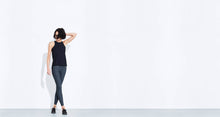 Grey colored technical leggings with bonded seams, gunmetal zippers + a side phone pocket