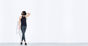 Grey colored technical leggings with bonded seams, gunmetal zippers + a side phone pocket