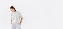 Cloud colored, recycled, reversible kimono style scuba jacket made from 41 recycled water bottles.