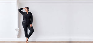 Black colored technical leggings with bonded seams, gunmetal zippers + a side phone pocket